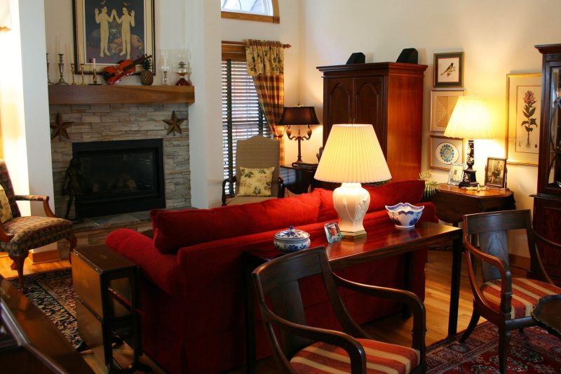 Warm living room with classic furniture, a cozy fireplace, and inviting decor for relaxation.